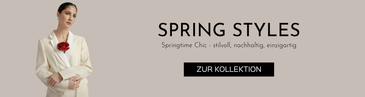 Frau mit cremefarbenem secondhand Blazer und einer roten Rose