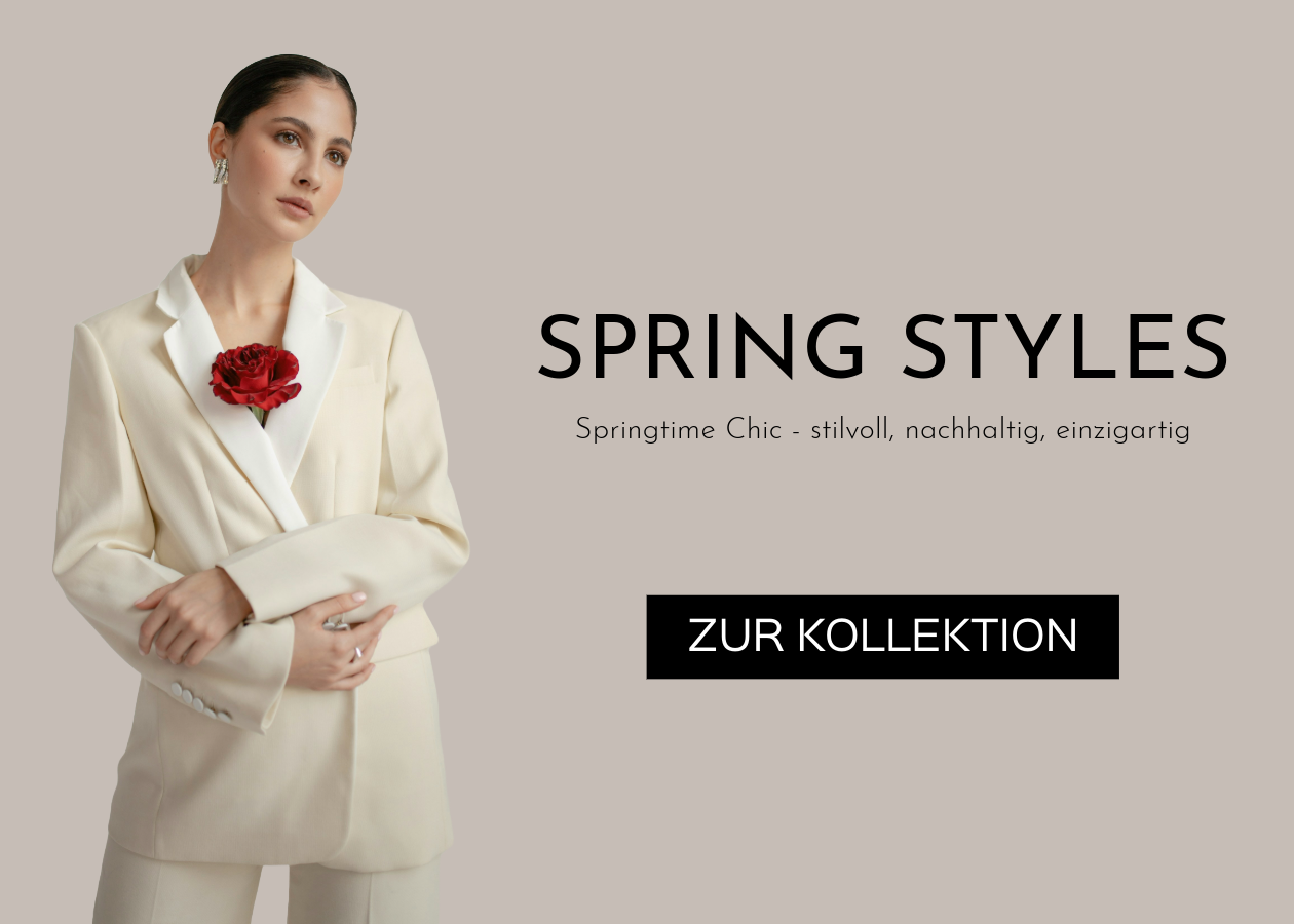 Frau mit cremefarbenem secondhand Blazer und einer roten Rose